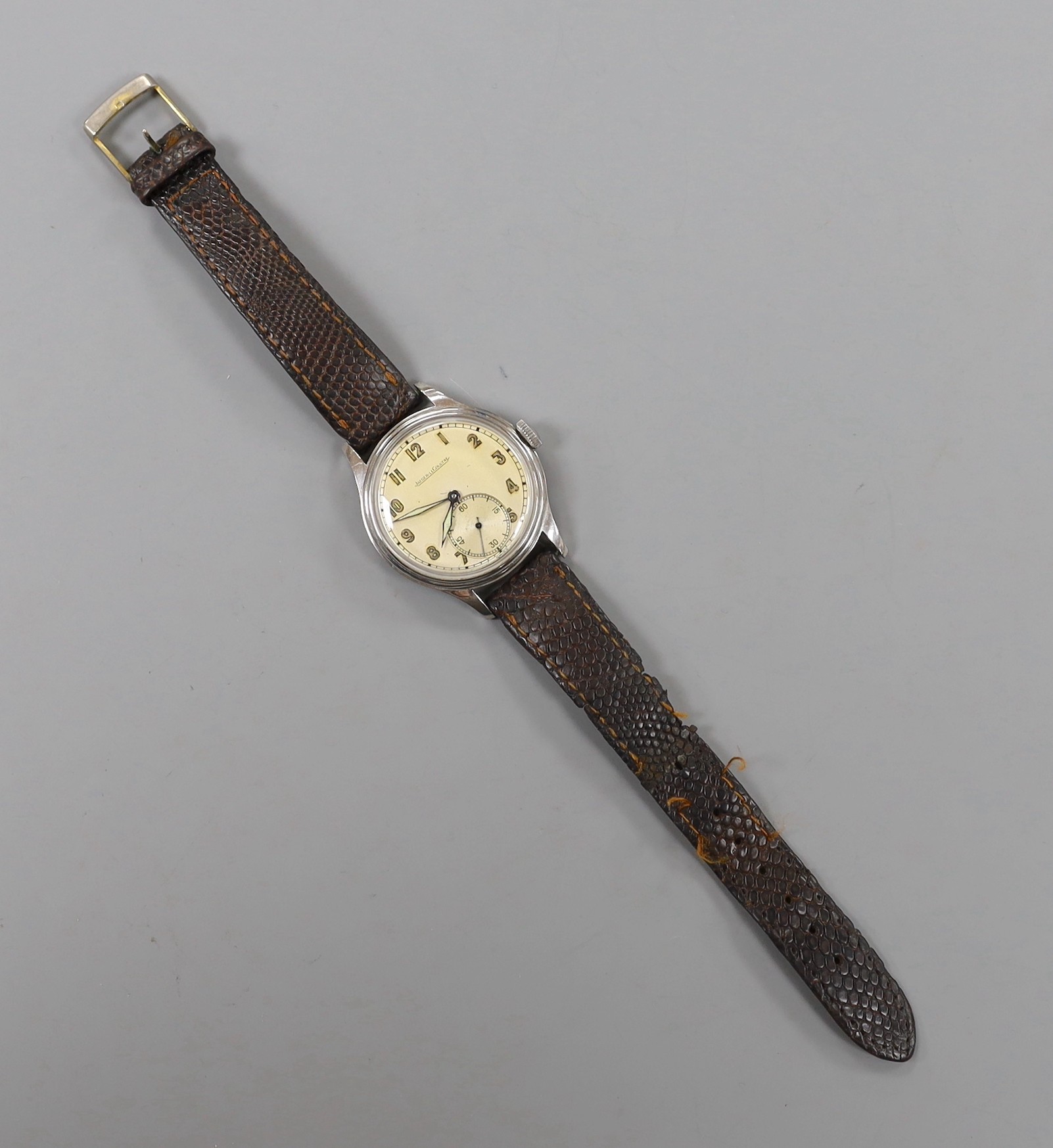 A gentleman's stainless steel Jaeger LeCoultre manual wind wrist watch, with Arabic dial and subsidiary seconds, on associated leather strap.